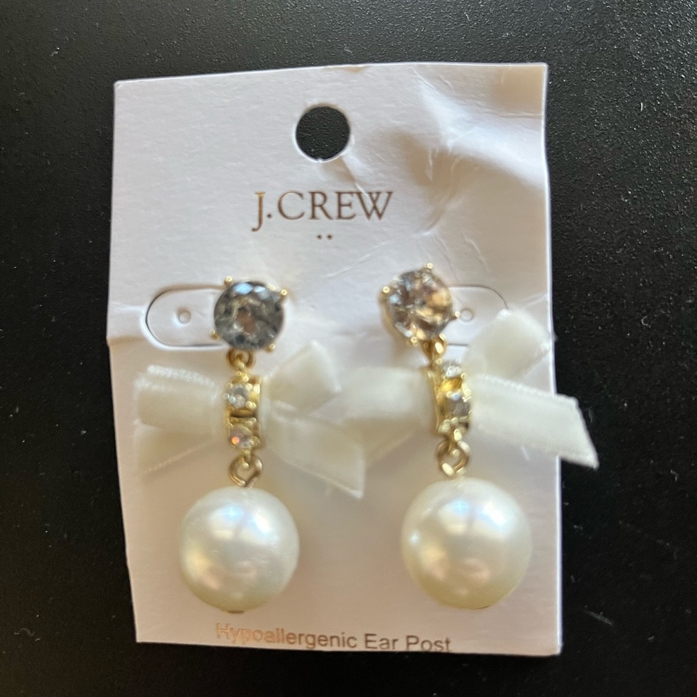 Crystal bow and pearl drop statement earrings